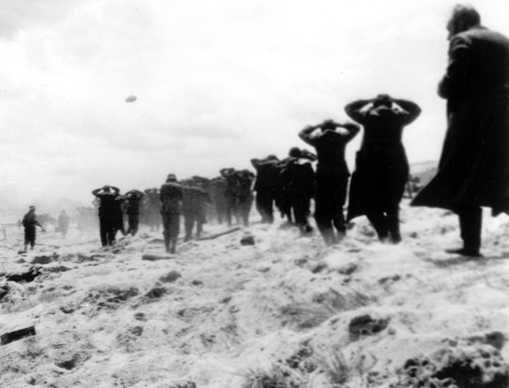 German POWs led away by Allied forces on D-day